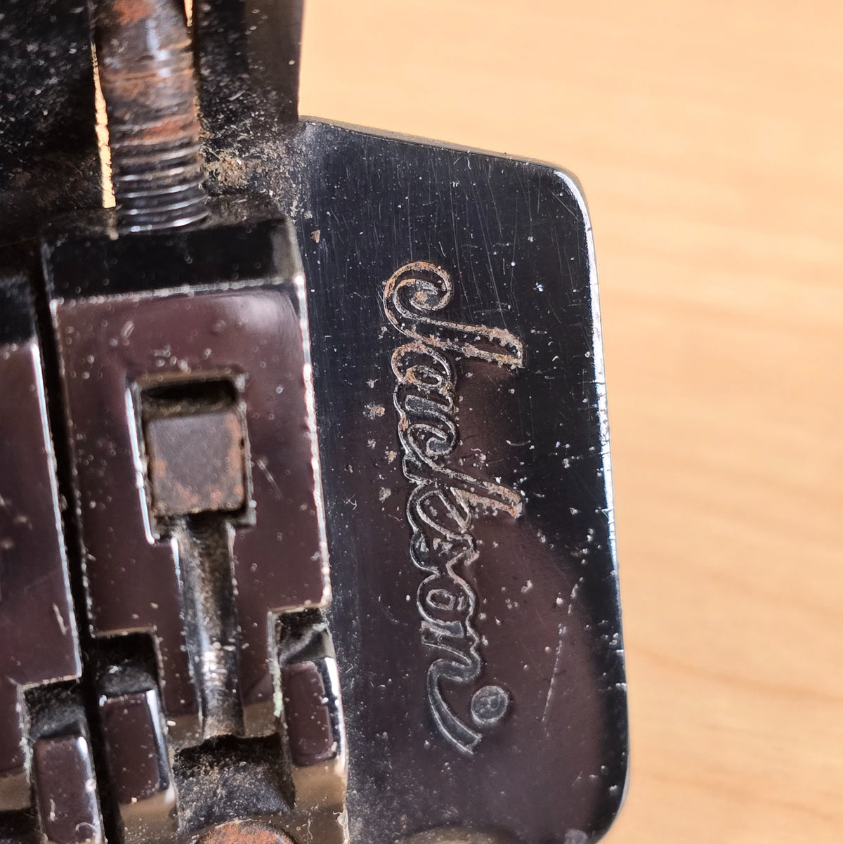 Close-up of Jackson logo stamped on the baseplate