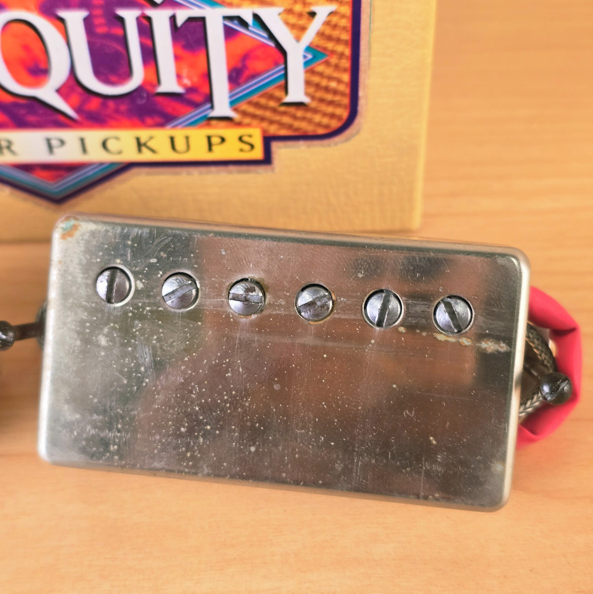 Top view of Seymour Duncan Antiquity bridge humbucker pickup with aged nickel cover