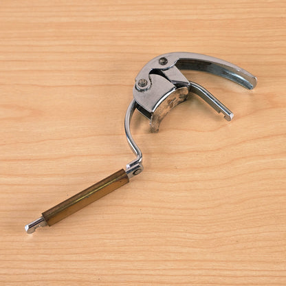 Hamilton KB19A capo unlatched with the swing arm swung open.