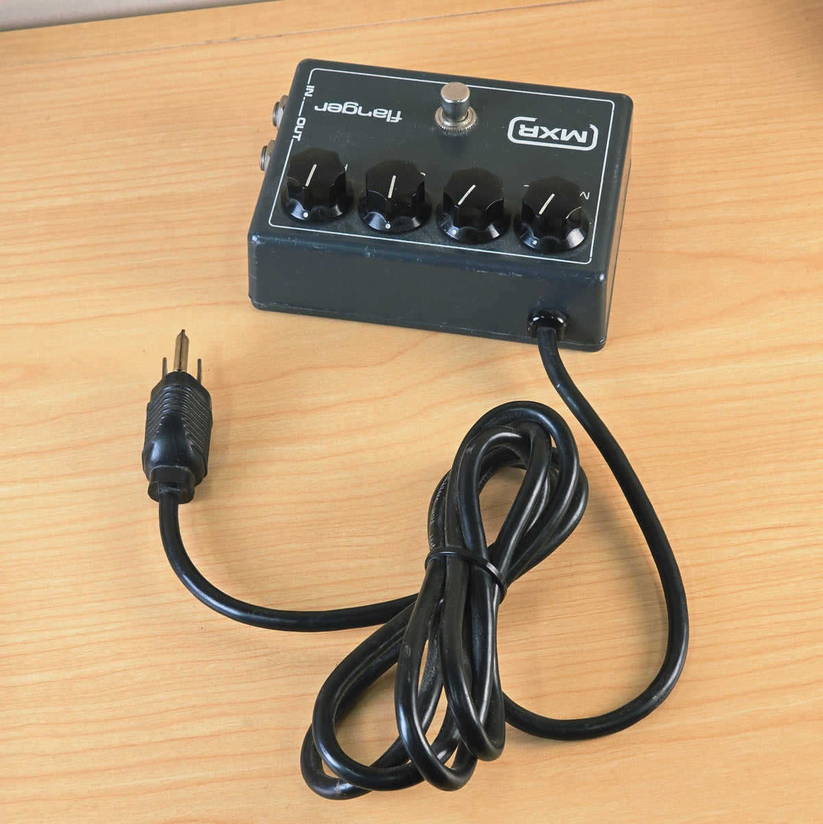 Overhead view of MXR Flanger pedal with coiled black power cord.