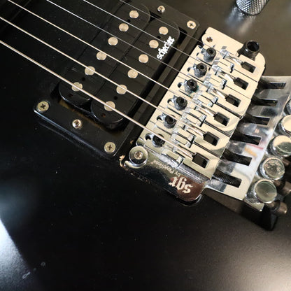 Close-up of the SGR by Floyd Rose tremolo bridge and bridge humbucker pickup.