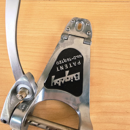 Angled view showing the hinge connection and Bigsby patent plate.