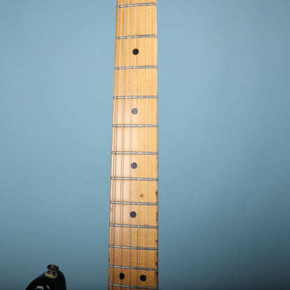 Close-up of the maple fretboard and neck frets