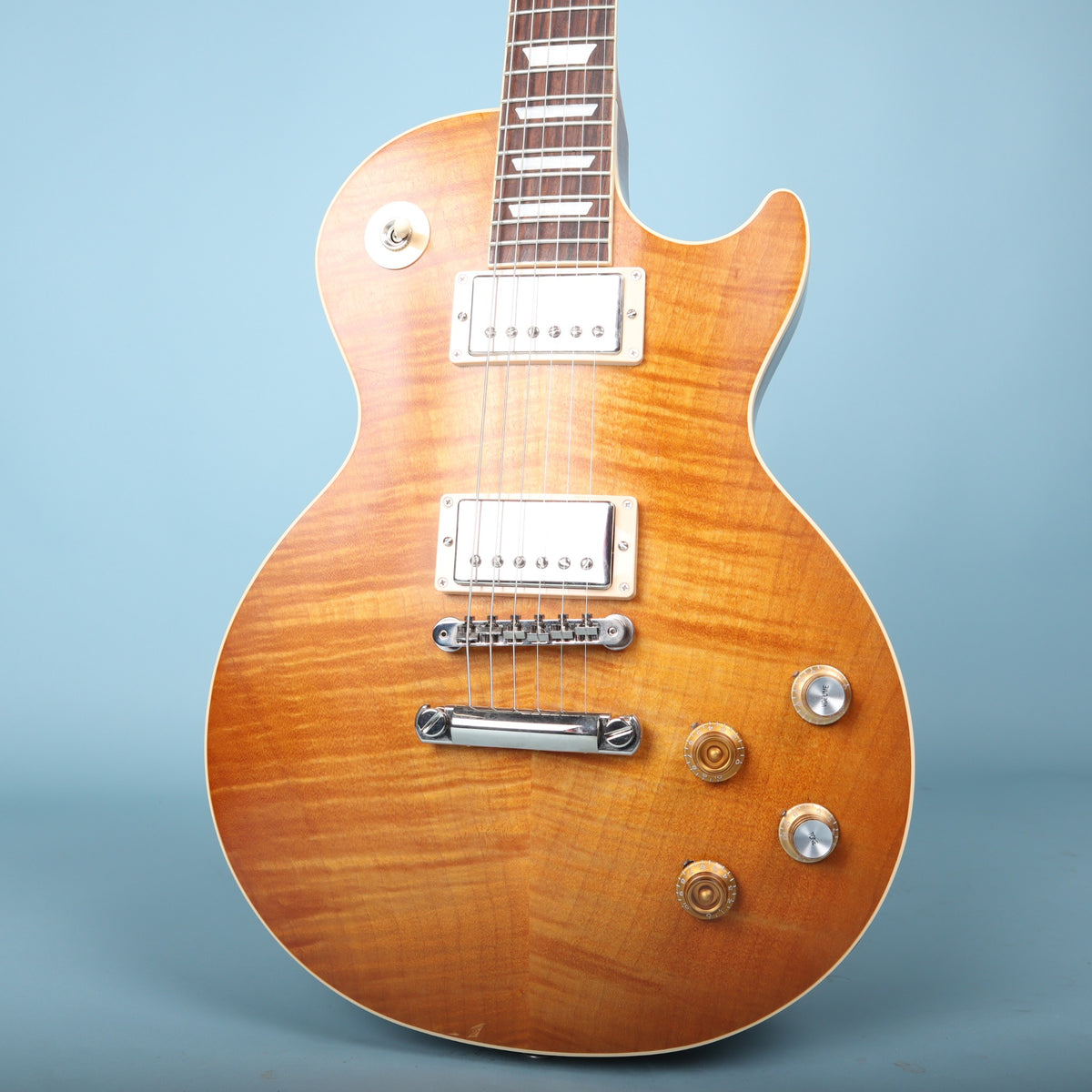 Front view of a 2023 Gibson Les Paul Standard '60s Faded electric guitar with flame maple top