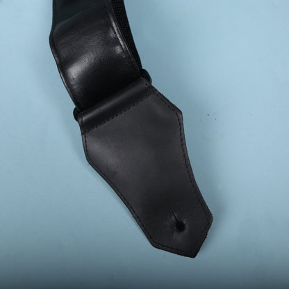 Backside of the leather strap end tab showing the mounting slit