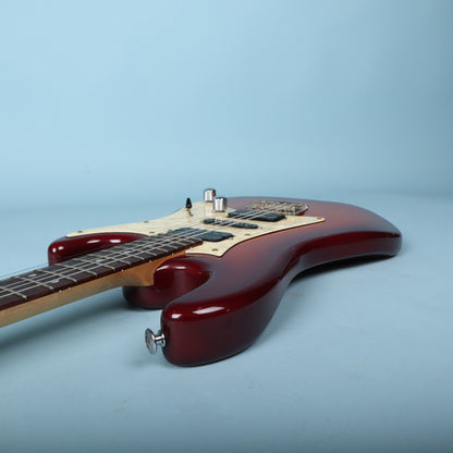 Profile view highlighting upper bout cutaway and neck pocket joinery.