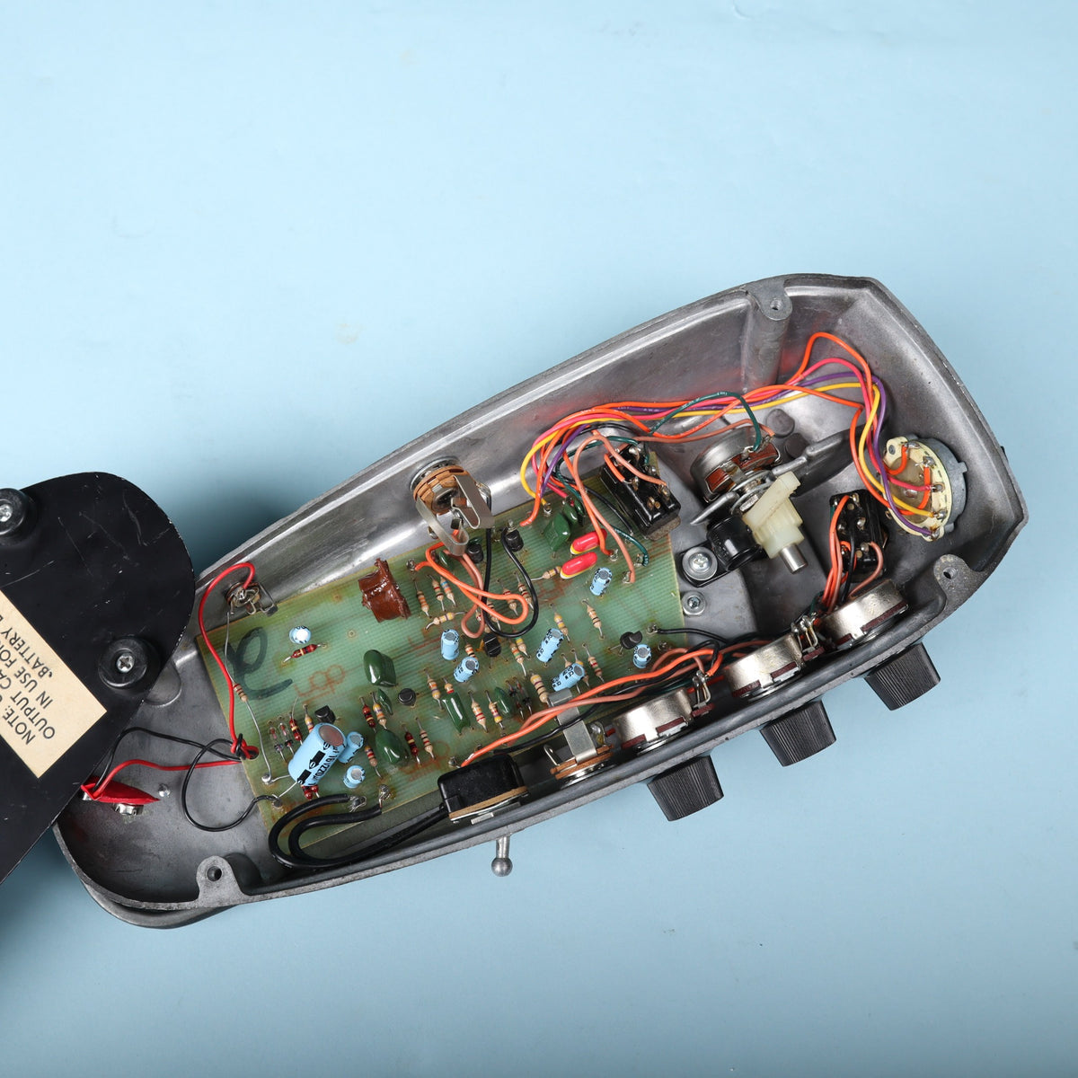 Internal circuit view showing original PCB layout, hand wiring, and potentiometer arrangement