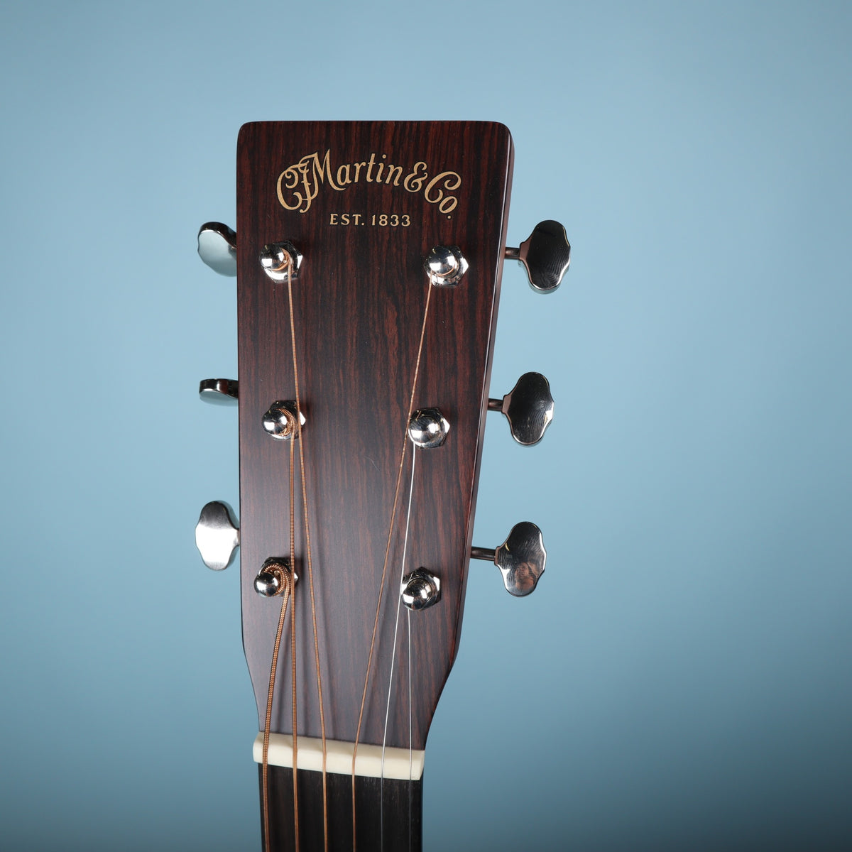Front view of the Martin 0-18 headstock with C. F. Martin & Co. logo and rosewood headplate.