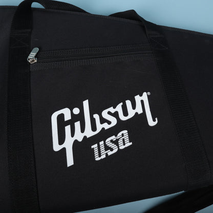 Close-up of the white screen-printed Gibson USA logo and zippered front pouch.