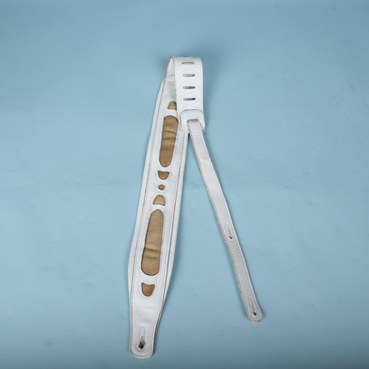 Full front view of the white leather guitar strap featuring tan faux fur inlays.