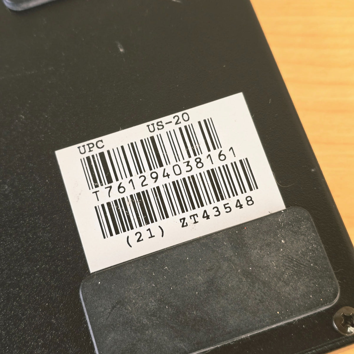Close-up of bottom barcode label showing model US-20 and serial number ZT43548.