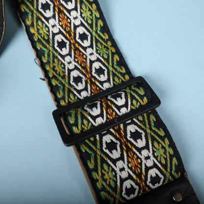 Close-up of the black plastic adjustment buckle on the woven jacquard strap.
