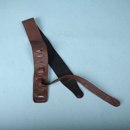 Rear view of the Levy's guitar strap showing the black garment leather backing and adjustment tail