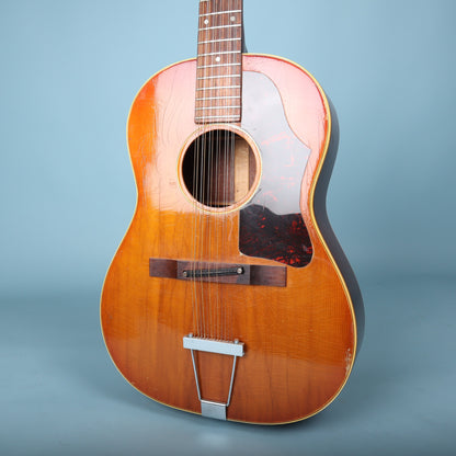 Lower bout of the Gibson B-25-12 spruce top showing the trapeze tailpiece and bridge.