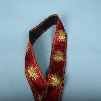 Folded loop of the strap showing red jacquard exterior and black interior