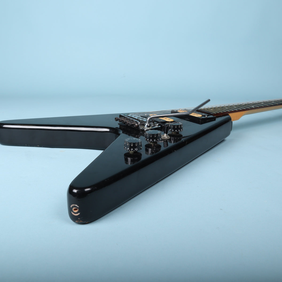Bottom perspective view of the lower body wing and strap button.
