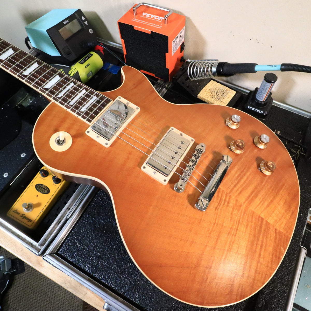 Gibson Les Paul on a workbench during inspection