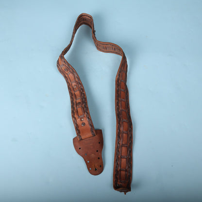 Full layout of vintage handmade Mexican leather guitar strap