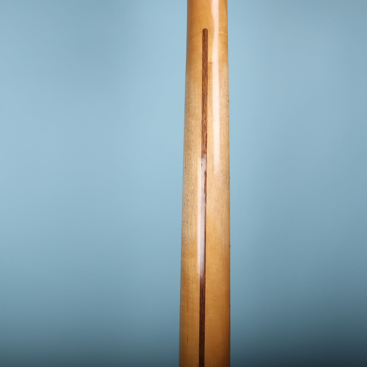 Back of the one-piece maple neck highlighting the walnut skunk stripe.