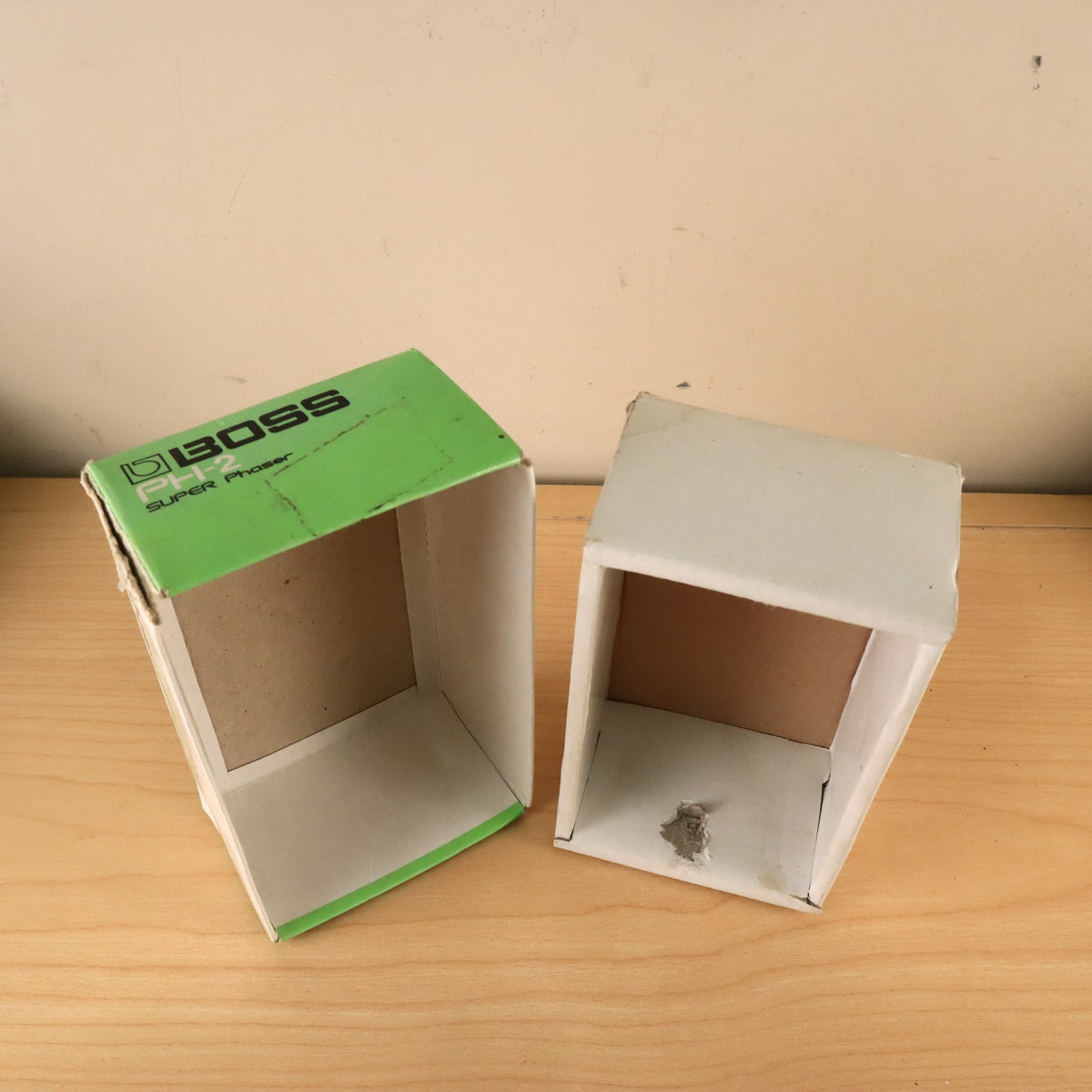 Top-down interior view of the empty BOSS PH-2 cardboard box sections.