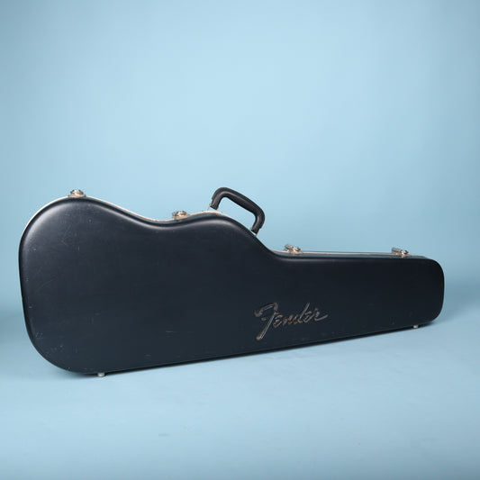 2000s Fender molded hardshell guitar case standing upright showing embossed logo