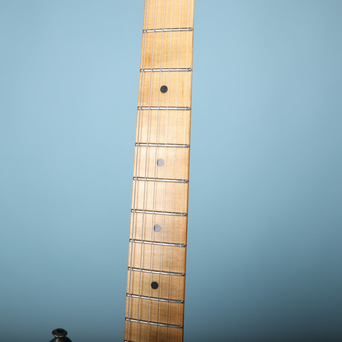 Close-up of maple fretboard on Charvel electric guitar