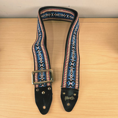 Front-facing view of the vintage Gibson woven strap hanging loosely