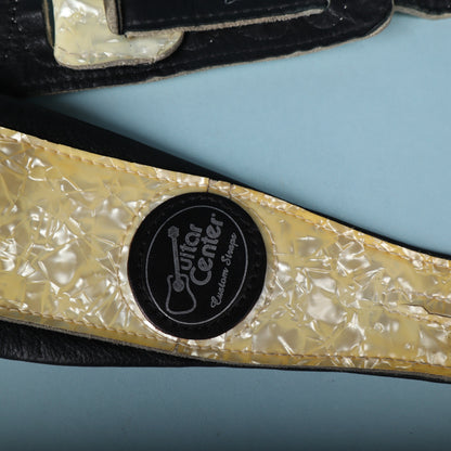 Close-up of the Guitar Center Custom Straps embossed circular logo badge.