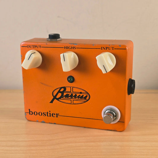 Front facing view of the Barriss Boostier orange effects pedal showing top controls and logo.