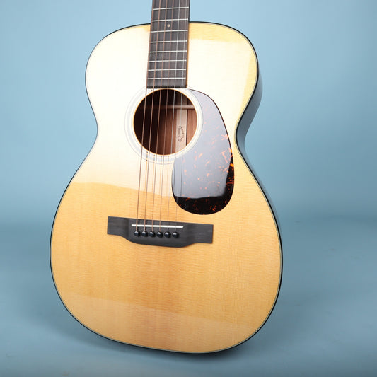 Front view of the Martin 0-18 body showing the spruce top, soundhole, bridge, and tortoise pickguard.
