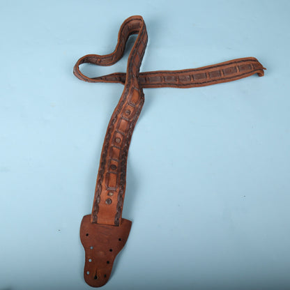 Full view of vintage brown handmade Mexican laced leather guitar strap