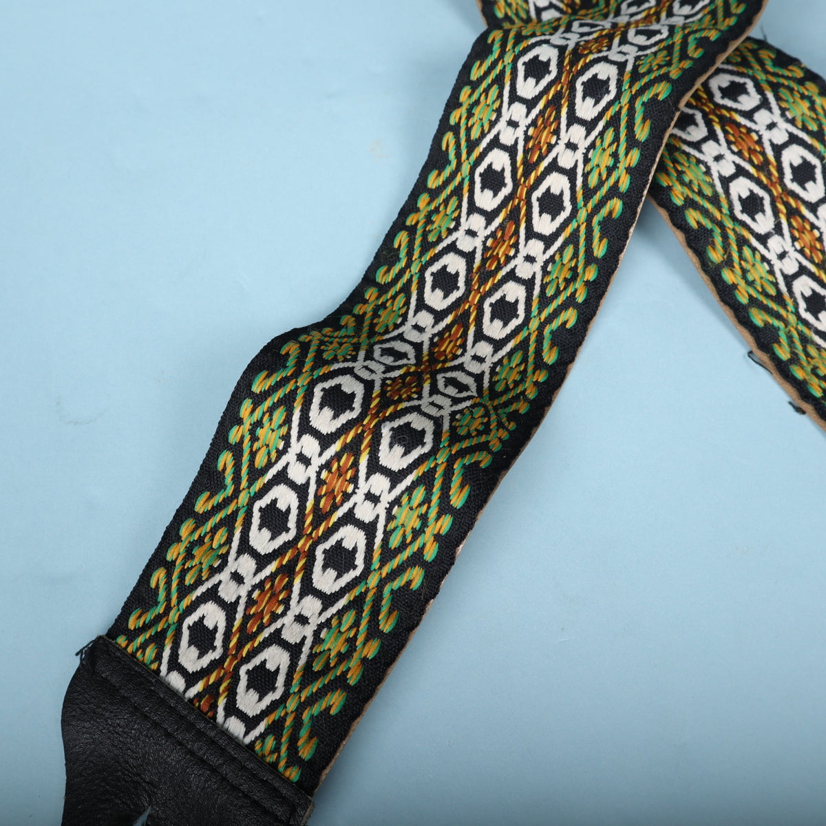 Detailed view of the intricate woven jacquard geometric pattern.