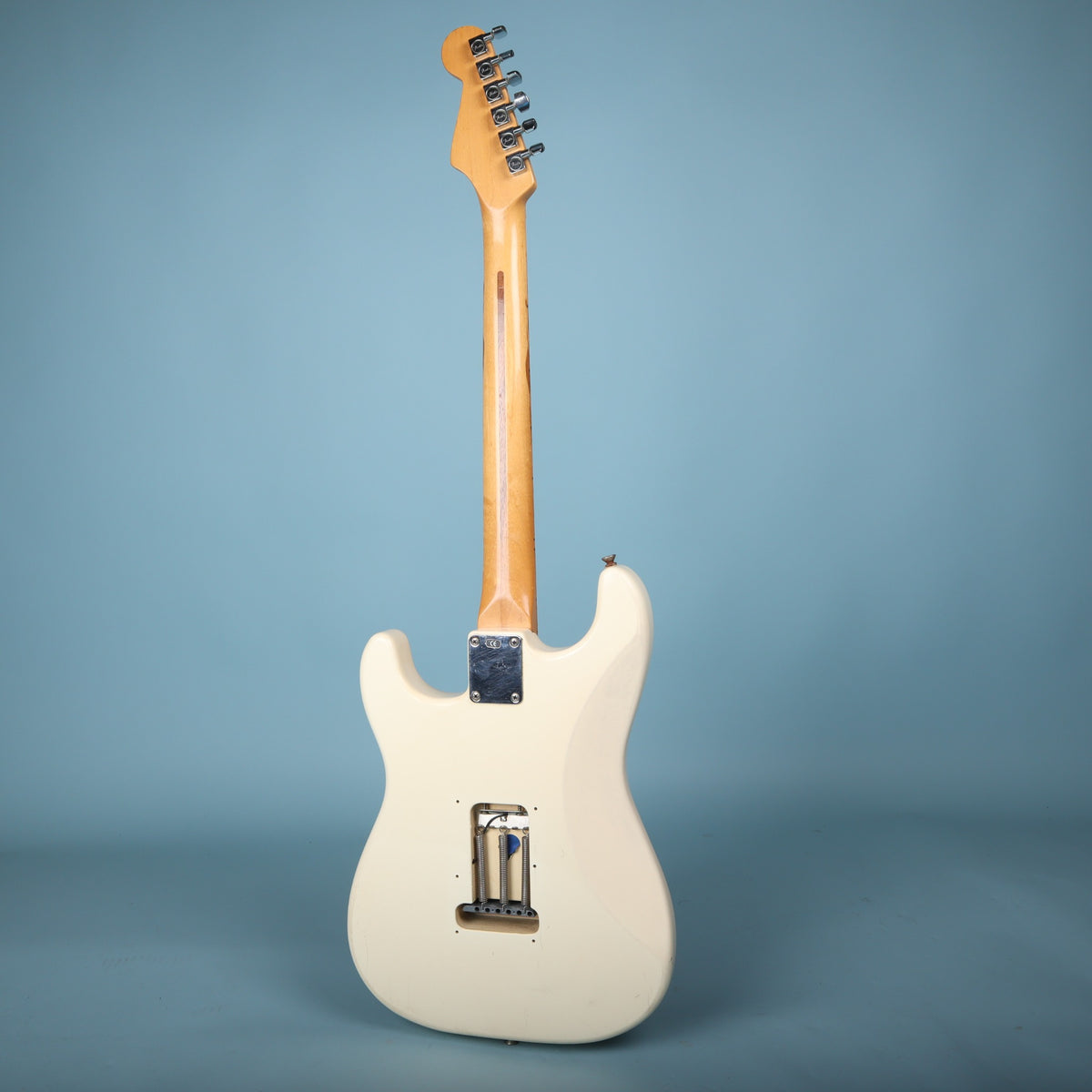 Full back view of white Fender Stratocaster electric guitar