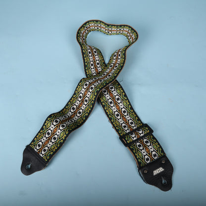Full front view of the vintage Ace strap showing the green, yellow, black, and white pattern.