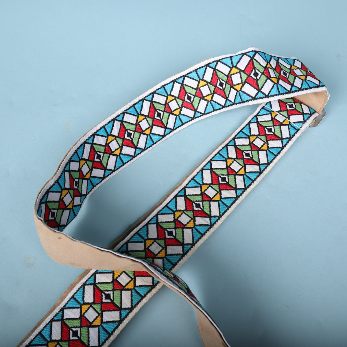 Overhead view of the Authentic Hendrix guitar strap loop showcasing the geometric pattern