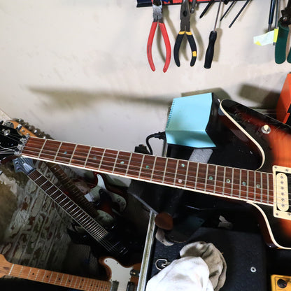 Dean ML fretboard and neck viewed on tech workbench
