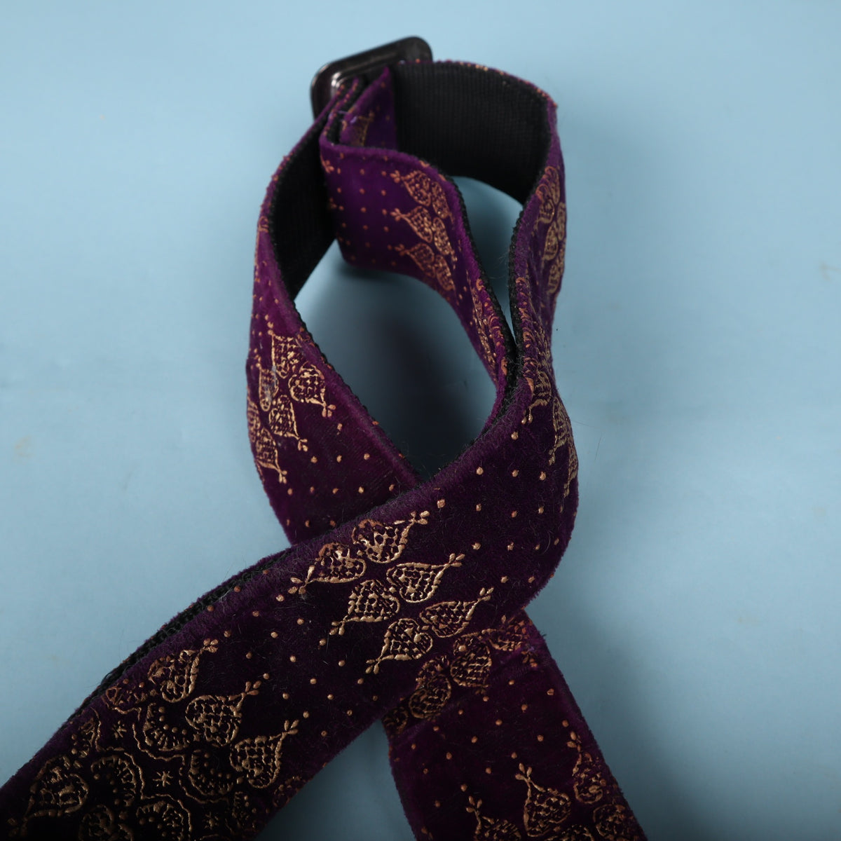 Top loop showing the purple velvet fabric and metal hardware slider