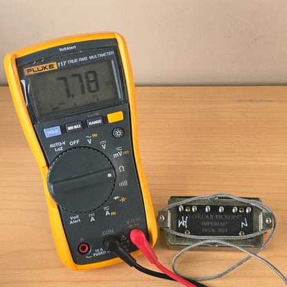 Fluke multimeter measuring the Lollar Imperial neck pickup resistance at 7.78 kΩ.