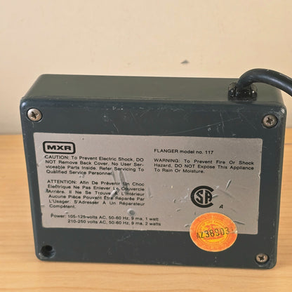 Close-up of silver rear label reading MXR Flanger model no. 117.