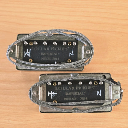 Underside of both Lollar Imperial humbuckers showing engraved branding and leads.