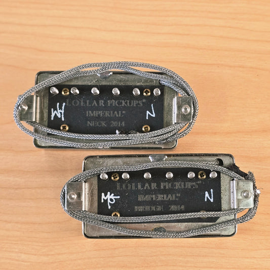 Underside of both Lollar Imperial humbuckers showing engraved branding and leads.