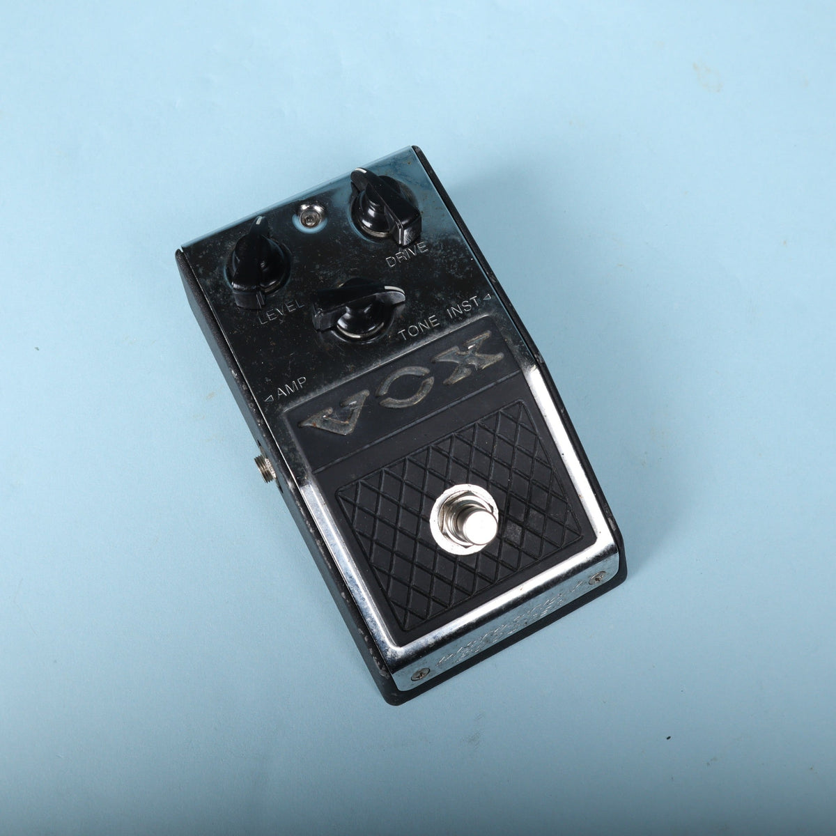 Top-down view of Vox V830 Distortion Booster pedal showing control knobs and footswitch