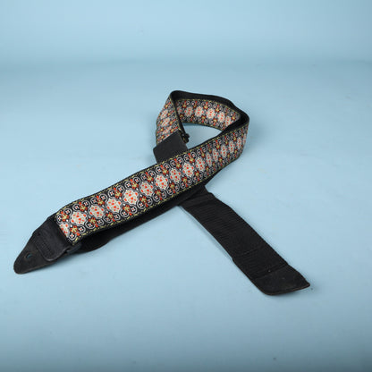 Angled view of the folded Ernie Ball woven jacquard guitar strap