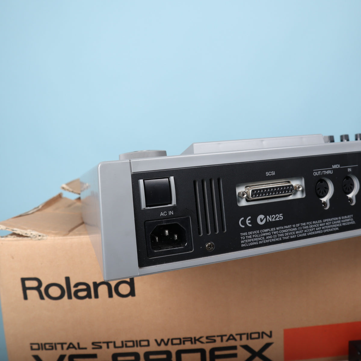 Close-up of AC power input jack, power switch, and rear ventilation on Roland VS-880EX.