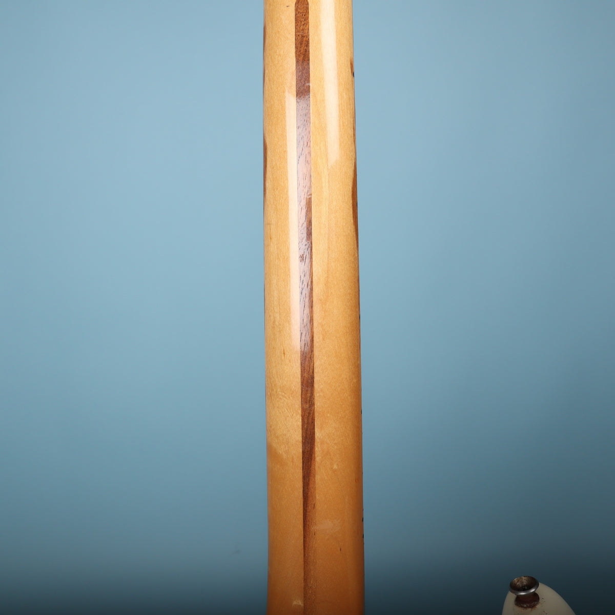 Close-up of back of maple neck showing walnut skunk stripe