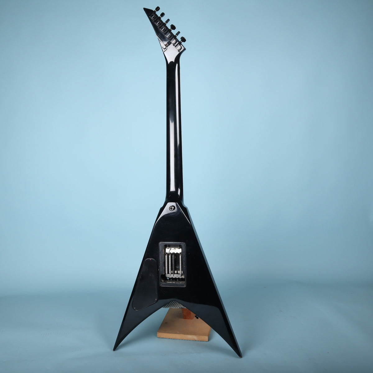 Full back view of the Jackson King V guitar on a stand