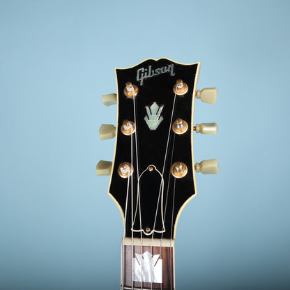 Headstock face with Gibson logo and crown inlay in mother-of-pearl.