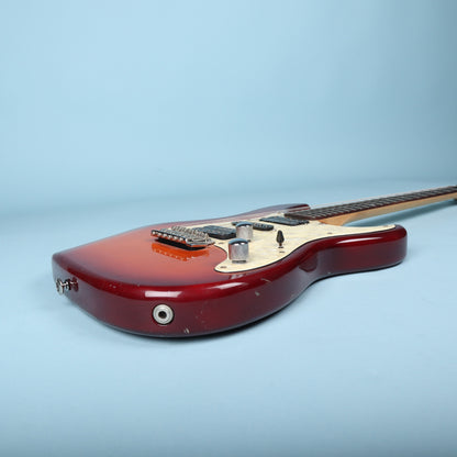 Bottom edge of guitar body showing output jack and lower strap button.