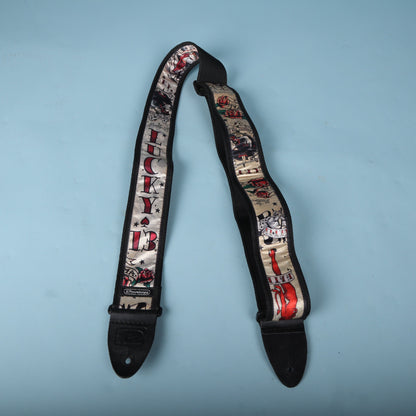 Full layout of the Dunlop Lucky 13 strap against a light blue backdrop