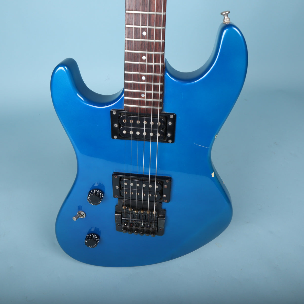 Close-up of the body front showing dual humbuckers and black Kahler tremolo bridge